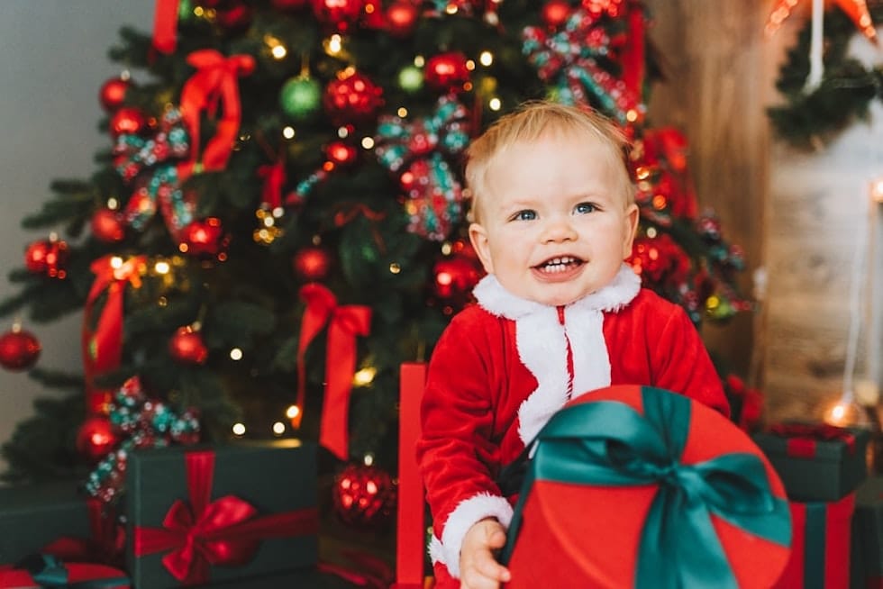 Boy with gift in his arms