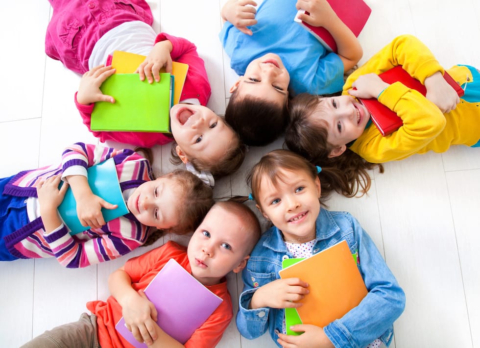 children standing on their backs