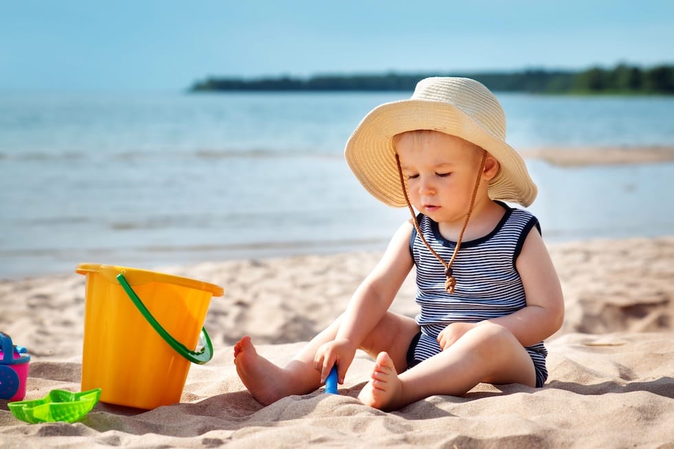 Boy playing in the sand 1