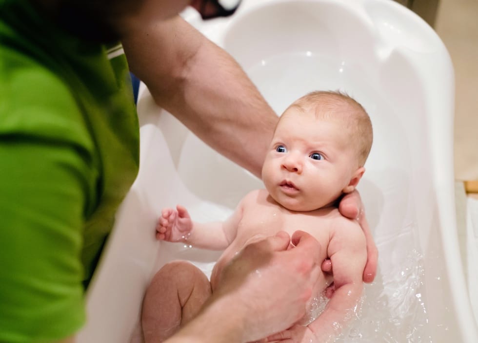 Little baby takes a bath