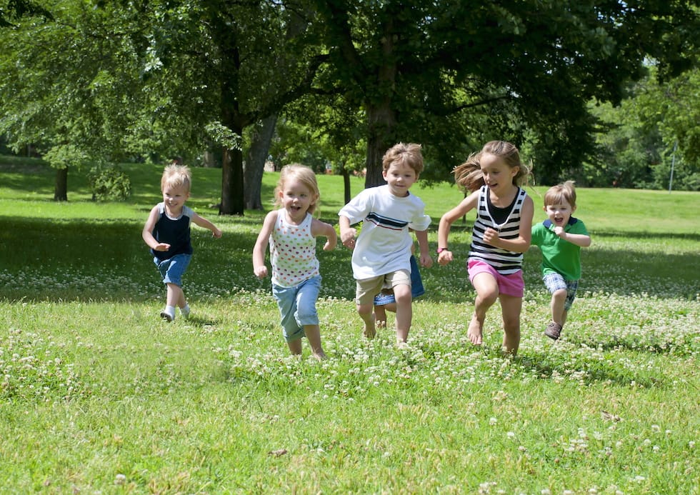 Children running through the park